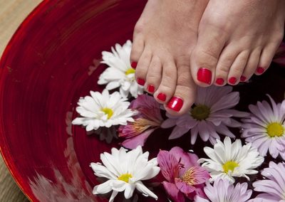 Relaxing pedicure foot soak with fresh flowers