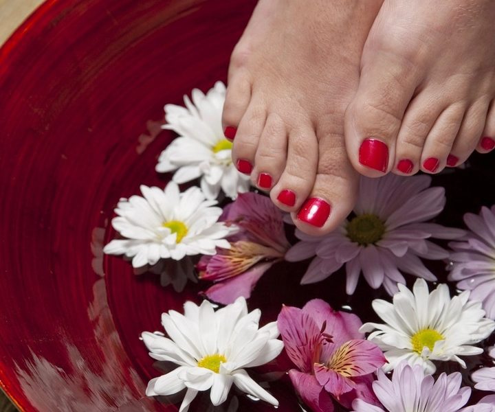 Relaxing pedicure foot soak with fresh flowers